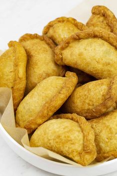 some fried food in a white bowl on a table