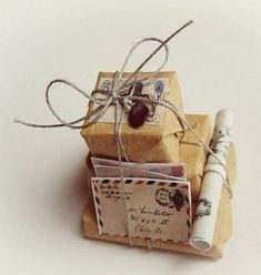 two wrapped presents tied with twine on top of each other