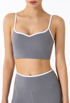 The Emes Shop sports bra is detailed with a white contrast hemline and straps. lined cups. an open low scoop back. and form fitted throughout. Pair it with our matching High Rise Contrast Biker Shorts for the cutest and easiest workout look.MATERIAL: 73% Nylon. 27% Spandex MEASUREMENTS: Small | Bust: 32.5" cm . Length: 30.5" cm Medium | Bust: 34.5" cm . Length: 32" cm Large | Bust: 36.5" cm . Length: 33.5" cm XL | Bust: 38.5" cm . Length: 35" cm MEASUREMENTS: Small | Bust: 12.8" in . Length: 12" in Medium | Bust: 13.6" in . Length: 12.6" in Large | Bust: 14.4" in . Length: 13.2" in XL | Bust: 15.2" in . Length: 13.8" in White Sports Bra With Built-in Bra And Wide Straps, Sports Bra With Straps In White, Gym Sports Bra With Built-in Cups, White Stretch Sports Bra With Straps, White Yoga Bra With Adjustable Straps, White Strappy Gym Activewear, White Gym Activewear With Straps, White Adjustable Straps Yoga Bra, Sporty White Sports Bra With Straps