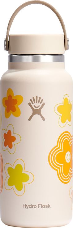 the hydro flask is designed to look like flowers and has a handle on it