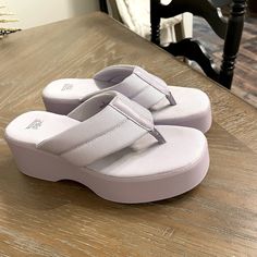 Never Worn Size 6 Casual Purple Wedge Sandals For Summer, Purple Synthetic Flip Flops For Summer, Casual Purple Round Toe Wedge Sandals, Purple Synthetic Summer Flip Flops, Lavender Round Toe Sandals For Beach, Lavender Round Toe Beach Sandals, Lavender Sandals For Summer Beach, Lavender Round Toe Synthetic Sandals, Lavender Synthetic Sandals With Round Toe