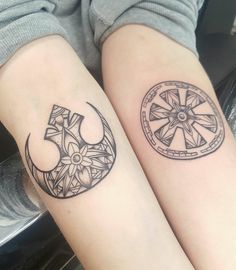 two people with tattoos on their legs and one has a star wars symbol in the middle