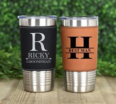 two personalized stainless steel tumblers sitting next to each other