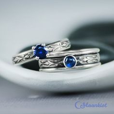 These Blue Sapphire Couple Rings make a striking pairing! The wide band ring features a 4 mm cabochon securely set in a fine silver bezel. The narrow band ring features a 5 mm faceted stone set in a filigree prong mounting. We are happy to create this beautiful set for you in a variety of gemstone choices, size options, and finishes.For the Wide Ring:This ring features a 4 mm cabochon set on a Sterling Silver band. The band measures 6 mm wide (about .25"). The Art Deco inspired design extends, u Sterling Silver Wide Band Stackable Jewelry, Sterling Silver Stackable Wide Band Jewelry, Handmade Sterling Silver Sapphire Ring For Anniversary, Anniversary Engraved Sapphire Ring In Sterling Silver, Rainbow Moonstone Engagement Ring, Matching Ring Set, Unique Promise Rings, June Birthstone Ring, Promise Ring Set