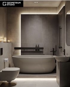 a modern bathroom with an oval bathtub and two sinks in it, along with candles on the wall