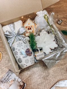 a christmas gift box filled with gifts and decorations