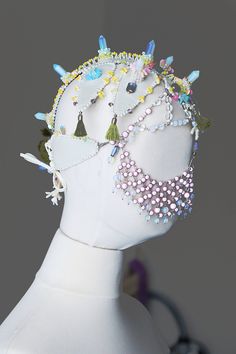 Masquerade face chain headpiece mask for carnival, festivals or burning man. Harajuku fashion mask. Headpiece made by bead embroidery technique. Crystal crown inspired by Japanese wedding costume. The trend of harajuku fashion. Size adjustable on back. Oversized headpiece. Headpiece made of: Vegan leather of vanilla color, White opal point beads, Round opal stone beads, Round transparent quartz stone beads, Glass crystal beads, Natural corals, Moss cotton tassels, Colored flakes, Seed beads, Veg Fantasy Style Masquerade Mask For Carnival Festival, Fantasy Masquerade Mask For Carnival Festival, Handmade Adjustable Headpiece For Masquerade, Fantasy Adjustable Headpieces For Carnival, Adjustable Fantasy Headpieces For Carnival, Beaded Festival Headband, Festival Beaded Headband, Headband For Mardi Gras Carnival, Beaded Headband For Festivals