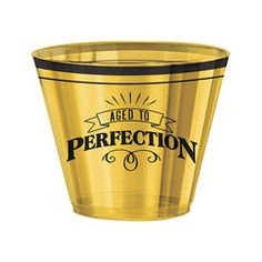 a yellow plastic cup with the words, aged to perfectionion written in black on it