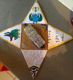 an origami star with pictures and writing on it