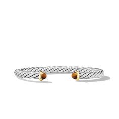 David Yurman's artistic signature, Cable began as a bracelet that he hand-twisted from 50 feet of wire. For the past 30 years, he has evolved the twisted helix into a myriad of designs. Sterling silver with 14-karat yellow gold Tiger's Eye Bracelet, 6mm David Yurman Style #: B35127MS4BTEM Gold Tiger Eye, Wedding Day Jewelry, Tiger Eye Bracelet, Metal Shop, Ring Pendant Necklace, Jewelry Repair, Custom Jewelry Design, Tiger's Eye, David Yurman