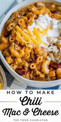 a white bowl filled with macaroni and cheese on top of a blue table cloth