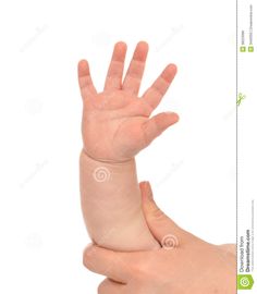 a baby's hand is held up in the air