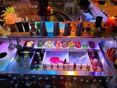 a display case filled with lots of different types of food and drinks on top of it