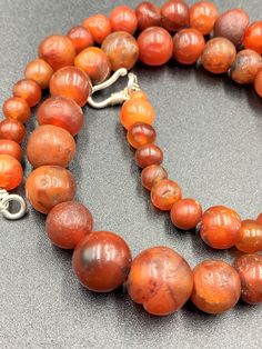 The Beautiful Roman's Era Dynasty Red Carnelian Agate Stone Jewelry Beads Necklace. The Age Of This Beads Are More Than 2000 Years Old. Conditions Of Beads As Shown In The Pictures. Rich In Patina. Round Carnelian Necklaces With Natural Stones, Carnelian Gemstone Round Beads, Polished Round Carnelian Beads Jewelry, Round Carnelian Gemstone Beads Necklace, Round Carnelian Gemstone Bead Necklaces, Red Carnelian Round Beads, Round Carnelian Gemstone Beaded Necklaces, Natural Carnelian Gemstones, Round Carnelian Beads For Jewelry Making