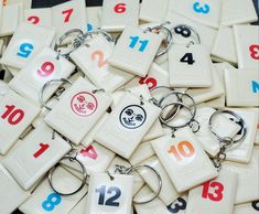 a bunch of key chains with numbers on them