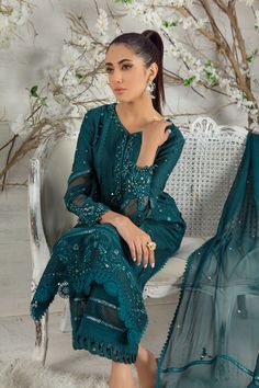 Stylish and trendy this mono tone silk net ensemble is a must have this Eid season, adorned with silk thread embroidery enhance with sequins, beads, pearls and stunning glitzy mirror details to accentuate the entire look, lace composed panels and bead tassel completes this look, paired with lace detailed culottes, mirror, pearl and lace embellished chiffon dupatta to uplift your day or night look. Shirt Fabric: Pure Silk Net Shirt Length: 45” cullotes Fabric: Khaadi Silk Dupatta Fabric: Pure Chi Organza Palazzo Set With Intricate Embroidery For Party, Party Palazzo Set With Intricate Embroidery, Festive Palazzo Set With Intricate Embroidery, Festive Palazzo Set With Intricate Embroidery For Party Wear, Festive Intricate Embroidered Palazzo Set, Festive Embroidered Palazzo Set For Party Wear, Unstitched Embellished Chinon Dress, Glamorous Georgette Dresses For Diwali, Glamorous Tissue Silk Sets With Zari Work