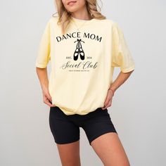 Show the world you're a proud dance mom in this adorable shirt! Made from quality materials, this shirt is soft, breathable, and comfortable. Please refer to size and color charts when selecting color. Certain styles are only available in certain colors. Feel free to message us for any special requests, or questions!  Wash instructions: Wash inside out with like colors. Hang dry, or tumble dry on low. Do not iron. Casual T-shirt With Letter Print For Dance Class, Casual Graphic Print T-shirt For Dance Class, Stretch Cotton T-shirt For Dance Class, Fitted Cotton T-shirt For Dance Class, Cotton Short Sleeve Tops For Dance Class, Stretch Graphic Print Tops For Dance Class, Stretch Tops With Graphic Print For Dance Class, Casual Tops For Summer Dance Class, Casual Summer Tops For Dance Class