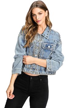 Traditional denim jacket embellished with studs and jewels all-over. Vintage wash with a baggy fit and cropped length. Patch pockets on the front and button up closure. No stretch in denim. CARE | Machine Wash Cold CONTENTS | 100% Cotton MEASUREMENTS | 20"/51 cm Top to Bottom (Size Small) MODEL | 5'8 - wearing a size Small IMPORTED Black Dungaree, Denim Jacket With Hoodie, Studded Denim Jacket, Faux Suede Vest, Marina Laswick, Cropped Moto Jacket, Faux Leather Vest, Denim Hoodie, Womens Trendy Tops