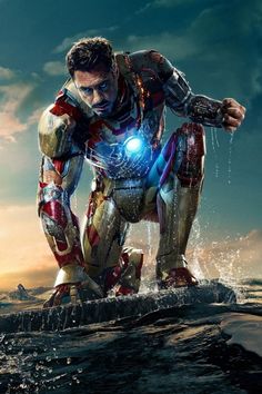 iron man standing in the water with his hands on his hips