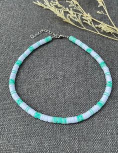 This necklace is handmade to last, with a nice colorful pattern, perfect for the summer ( or any time of the year, really)! This choker necklace gives bohemian-style vibes to your look. Each boho-style necklace was created with 6mm clay polymer discs, stainless steel-look lobster clasp, and 2 inch extender chain. I'm offering this necklace in seven different lengths. If you are interested in a different length or colors, please message me! My business thrives on Customer Satisfaction Please do not hesitate to reach me in case there is something wrong with your purchase. I will try my best to make it right for you. Thank you for shopping JGBestBeadedJewelry! Casual Green Necklace For Vacation, Casual Green Choker Jewelry, Green Letter Beads Necklace For Festival, Green Letter Beads Necklace For Festivals, Casual Green Choker Necklace, Green Heishi Beads Summer Jewelry, Green Letter Beads Necklace For Beach, Summer Green Heishi Beads Jewelry, Handmade Green Casual Necklaces