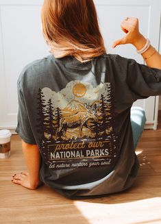 ✺ PROTECT OUR NATIONAL PARKS - GRANOLA GIRL GRAPHIC SHIRT  ✺ Get this trendy Comfort Colors graphic tee. * Q U I C K F A C T S * This design is a unique, one-of-a-kind awesome illustration that has been created in house. ✺ 100% ring-spun cotton ✺ Medium fabric ✺ Relaxed fit Please note that colours may appear different on different digital screens and may not be a true representation of the actual colours. This is a Unisex T-Shirt which you can use as an Oversize T-Shirt Dress, please check the Printed Cotton Tops For Outdoor, Outdoor Cotton Printed Tops, Camping Tee Shirts, Granola Style, Earth Day Shirt, National Park Shirt, Camping Tee, Oversized T Shirt Dress, Oversize T Shirt