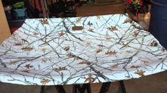 an ironing board covered with branches and leaves