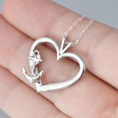 ⚓ Silver Anchor Heart Necklace ⚓A sterling silver anchor, featured on the side of a sterling silver heart :) A wonderful way to express a love that anchors you. If you have a beach wedding coming up (attending or planning!) this would be a wonderful piece to wear on the occasion. The pendant includes a sterling silver curb chain. You can choose the chain length (16,18 or 20 inches) from the drop-down menu. D E T A I L S• The length of the pendant is about 1 inch• Sterling Silver• Includes Silver Anchor Heart, Anchor Jewelry, Necklace Gift Box, Anchor Pendant, Anchor Necklace, Nautical Jewelry, Sterling Silver Heart, Summer Jewelry, Silver Heart