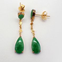 Vintage 18k (.750) yellow gold dangle drop earrings, decorated with Green Jade stones. The stones have no signs of dye under the microscope. The backings are made of 14k (.585) gold. These elegant earrings are 36mm long, weighing a total 3.6 grams. EA3229 Jade Dangle Earrings, Under The Microscope, Gold Tassel Earrings, Funky Earrings, Pendant Watches, Jade Earrings, Classic Earrings, Gemstone Stud Earrings, Elephant Pendant