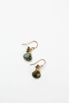 The perfect dangle earrings for the Tranquil Gardens Collection. This artisan design rests at approximately 1" from gold filled ear wires. Matte Gold Plated Brass (nickel and lead-safe) African Turquoise 1", with gold filled ear wires We hand select our natural materials, thus there may be slight variations in color and/or size that will not detract from the overall aesthetic Our unique handcrafted designer jewelry for women is made in America, each design created individually in our personal de Floyd Va, Silver Gold Earrings, Silver Gold Necklace, African Turquoise, Artisan Design, Cluster Earrings, Gold Collection, Matte Gold, Designer Jewelry