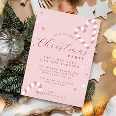 a pink christmas party card with candy canes on it next to other holiday decorations