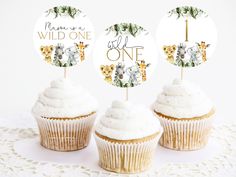 three cupcakes with white frosting are on a doily that says merry wild one