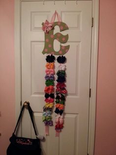 the door is decorated with ribbons and numbers for girls to use in their home decor