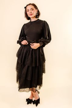 A cozy fall season calls for warm fashion and we've created just that. The perfect mix of ribbed, knit sweater material, balloon sleeves, and layers and layers of tulle. Nothing screams comfort and fashion quite like the Cosette Dress in Black. This dress has a little bit of stretch and an optional waist tie which looks stunning tied in the front or back. Available in sizes XXS, XS, S, M, L, XL, XXL, 1X, 2X, 3X, 4X, & 5X + kids! Cosette Dress, Layered Tulle Skirt, Sweater Material, Ribbed Knit Sweater, Cozy Fall, Balloon Sleeves, Fall Season, Waist Tie, Base Colour