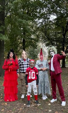 a group of people in costumes posing for a photo