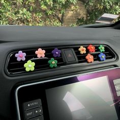 a car dashboard with some colorful flowers on it