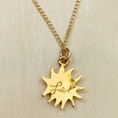 You’re My Sunshine - Sun Charm Necklace. Inspired by the brightness, beauty and warmth of our most natural source of Vitamin D, this pretty SUN charm is meant to bring you days filled with Sunny Rays. Lexi Jewelry exclusive design Handcrafted in USA. Sun charm is gold plated bronze measures approx 1/2” wide x 5/8” tall. 14Kt gold filled chain 16” long. Dainty Gold Charm Necklace With Sun Design, Gold Sun-shaped Jewelry For Everyday, Sun Design Pendant Necklace Gift, Sun Design Charm Necklace Gift, Gold Sun Design Pendant Jewelry, Gold Sun-shaped Necklace Gift, Gold Sun-shaped Necklace As A Gift, Gold Sun-shaped Necklace For Gift, Herkimer Diamond