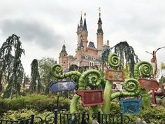 some strange looking plants in front of a castle