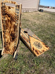 two wooden boards sitting in the grass