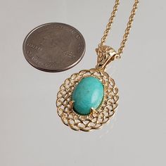 Elevate Your Style with Our Oval Filigree Turquoise Pendant Necklace 🌟Unleash your inner fashionista with our exquisite Oval Filigree Turquoise Pendant Necklace, a versatile accessory that effortlessly combines elegance and charm. Crafted with precision and passion, this necklace is designed to make a statement.The pendant's oval shape boasts an intricate filigree design that radiates sophistication and timeless beauty. Each delicate detail speaks volumes about the craftsmanship that went into Gold Turquoise Oval Necklace, Elegant Gold Turquoise Necklace With Oval Pendant, Elegant Turquoise Necklace With Round Pendant, Elegant Turquoise Gemstone Necklace With Oval Pendant, Elegant Oval Turquoise Gemstone Pendant Necklace, Elegant Turquoise Oval Pendant Necklace, Elegant Oval Turquoise Necklace As Gift, Elegant Oval Turquoise Necklace For Gift, Elegant Oval Turquoise Necklace Gift