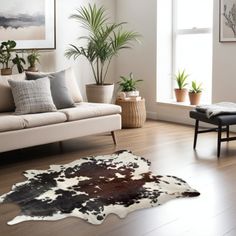 a living room filled with furniture and plants