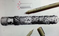 two pens are laying on top of a drawing