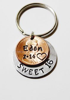 a penny keychain with the words eon and sweet 16 written on it