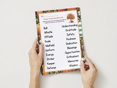 two hands holding up a printable halloween word search