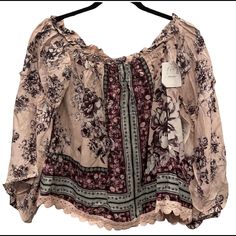 Multi Print Top With Bell Sleeves. Floral . Embroidered Hem Trim. Can Be Worn On Or Off The Shoulders. New With Tags Never Worn . Size L Junior Arm Pit To Arm Pit 19” Top Of Shoulder To Hem 19” Purple Floral Embroidered Top For Fall, Purple Floral Embroidery Top For Fall, Purple Fall Tops For Vacation, Purple Tops For Fall Vacation, Purple Bohemian Blouse For Spring, Casual Purple Tops For Fall Vacation, Purple Tops For Beach In Fall, Bohemian Purple Blouse For Spring, Summer Purple Tops With Floral Embroidery