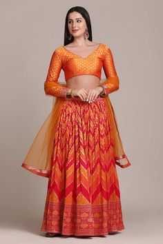 color-orange, fabric-jacquard, work-gold woven, brand-name-krupali-savani,occasion-festivewear, occasion-wedding-guest, womenswear,ideal-for-women, lehengas, Product Features: Color: Orange Lehenga Fabric: Jacquard Silk Choli Fabric: Jacquard Silk Work: Gold Woven Sleeves: 3/4 Sleeves Neck Type: V Neck Wash Care: Dry Clean Occasion: Festivewear, Wedding Guest Product Type: Lehenga Choli with Dupatta Disclaimer: There will be slight difference in digital to actual image A Line Lehenga, Orange Lehenga, Indian Wedding Lehenga, Full Sleeve Blouse, Organza Lehenga, Lehenga Fabric, Celebrity Gowns, Indian Bridal Lehenga, Choli Designs