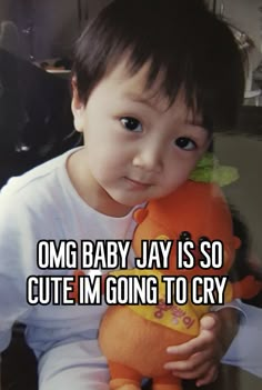 a little boy holding a stuffed animal in his hands with the caption omg baby jay is so cute i'm going to cry