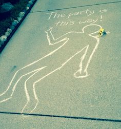 a drawing on the sidewalk that says, the party is this way with a person holding a yellow piece of paper