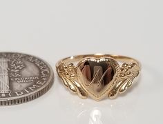 "Thanks for shopping our vintage estate store. We tend to sell well below wholesale and truly hope you enjoy all of our items. Many of the items are one of a kind, so please enjoy scrolling through the pictures and hopefully something will catch your eye. Brown spots are from camera or reflections. Estate 14k yellow gold monogram cursive capital N heart ring. Custom made ring for our shop. Ring size: 3 Setting: 7.5mm 1/4\" to 3/8\" Band width: 1.4mm Weight: 1.10 gram Marked 14k and it's sweet. O Vintage Gold Initial Ring Stamped 14k, Personalized Engraved Yellow Gold Ring For Collectors, Classic Gold Initial Ring Collectible, Vintage 14k Stamped Initial Ring As Gift, Gold Signet Ring For Valentine's Day Stamped 14k, Personalized Yellow Gold Signet Ring Collectible, Vintage Engraved Rings For Valentine's Day, Heirloom Gold Initial Ring With Hallmarks, Vintage Gold Initial Ring With Polished Finish