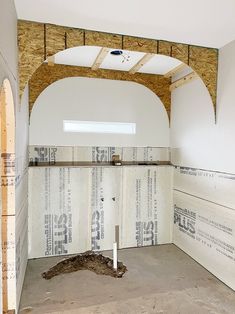 an unfinished room with exposed ceiling and walls that have been built into the wall,