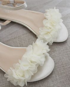 Classy satin flat sandals with a chiffon flowers and ankle strap. Effortless yet adorable to wear on your favorite occasion. Can be pair with dress or casual look.DETAILS:COLORS AVAILABLE: Ivory, White, Pink, Light Blue, and ChampagneUPPER: Synthetic upper and liningMATERIALS: Mandmade outsoleSTYLE NAME: MADDY Summer Flat Heel Bridesmaid Wedding Shoes, Summer Wedding Shoes With Flat Heel For Bridesmaids, Summer Bridesmaid Wedding Shoes With Flat Heel, Flat Summer Wedding Shoes For Bridesmaids, Spring Bridesmaid Open Toe Sandals, Summer Bridal Shower Low Heel Sandals, White Sandals For Bridesmaid In Spring, White Sandals For Spring Bridesmaid, Birthday Party Princess